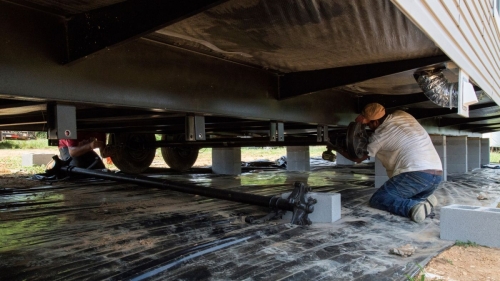 how are double wide manufactured homes leveled